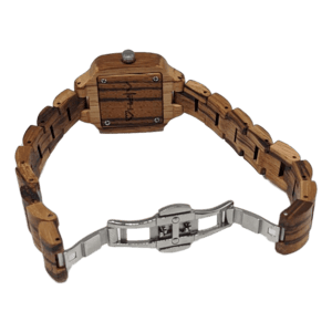 The Wahine wristwatch features a wooden band and a rectangular wooden face, complemented by a metal fold-over clasp mechanism. The back of the watch face reveals a natural wood grain pattern that captures the essence of Alpha Maui's stunning Hawaiian landscapes.
