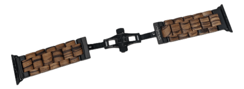 The Alpha Maui Band - Zebrawood 42mm (42-49mm) for Apple Watch features a unique design with segmented wooden blocks linked together by black connectors, and a clasp mechanism in the center for secure fastening. The wood texture adds an elegant, rustic touch to the watchband, evoking the natural beauty of Alpha Maui.