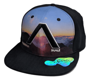 Introducing The Haleakala - Keiki Cap: A baseball cap for kids featuring a sunset and mountain design on the front panels with a striking black "A" in the center. The word "Maui" is displayed on the front right panel, "MAKALA" on the left, and "Aloha" subtly embroidered above. The bill boasts a shiny sticker, while the rest of the cap is black to embody Hawaii's spirit.
