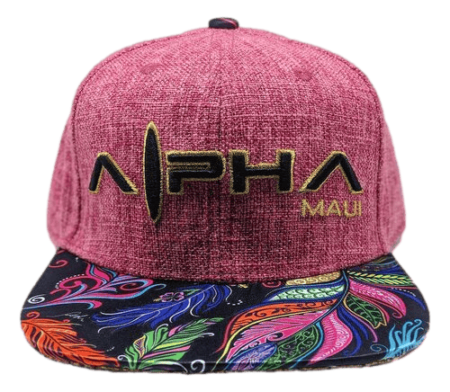 The "Feathers" cap is a vibrant red hat emblazoned with "Alpha Maui" in elegant gold letters on the front. Its visor showcases a beach-inspired, intricate leafy pattern brimming with vivid shades of blue, green, orange, red, and purple. Perfect for your next Hawaiian adventure!
