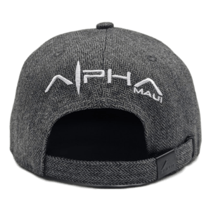 Back view of "The Specialist" grey adjustable snapback hat featuring a herringbone pattern. The hat displays the word "Alpha" in large white letters and has "Maui" stitched in smaller white letters above the opening on the back, evoking a sense of Aloha and Ohana.