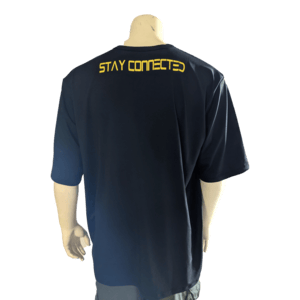 Rear view of a person wearing The Vibes t-shirt in dark blue with the phrase "STAY CONNECTED" written in yellow capital letters across the upper back. This beach apparel by Alpha Maui perfectly captures the Aloha spirit, as the person stands with their arms relaxed by their sides.