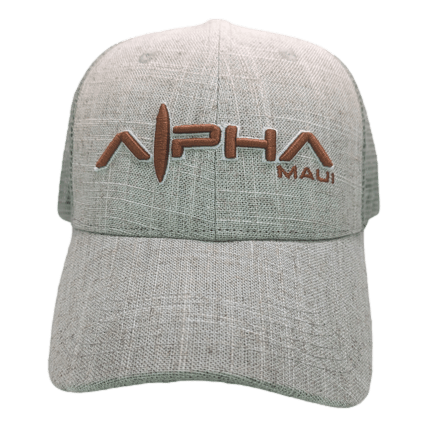 The Alpha Maui Sandy baseball cap is made of beige textured fabric, featuring the embroidered text "Alpha Maui" in brown on the front. The letter "A" in "Alpha" includes a surfboard design, evoking the spirit of Hawaii and Ohana.