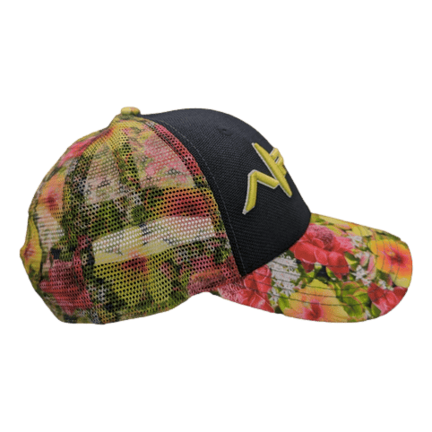 The Alpha Maui Botanical Queen is a vibrant cap showcasing a black front panel adorned with a yellow, stylized "N" logo and a floral-patterned mesh back and brim featuring shades of red, green, and pink. Inspired by the spirit of Hawaii, this cap also includes a yellow button on top and a curved brim.