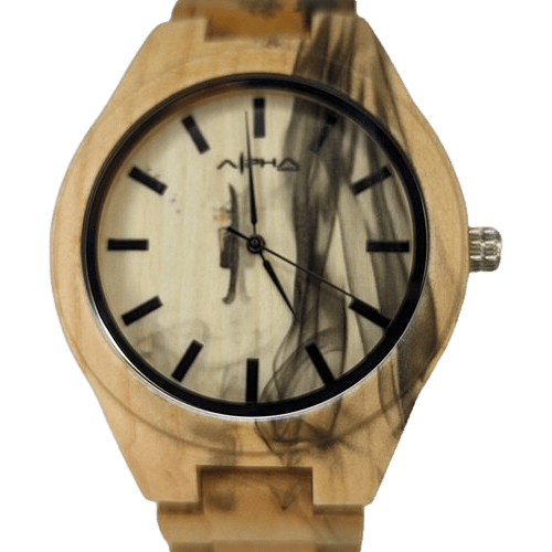 The Pueo Time wooden wristwatch features black hour markers and hands that perfectly complement its stylized smoky black design on a light wood background. Infused with Aloha spirit, the brand name is displayed below the 12 o'clock marker, while the wooden band adds a touch of Hawaii's natural elegance.