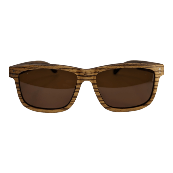 A pair of stylish sunglasses with rectangular frames. The frames have a unique wood grain texture and brown tinted lenses, embodying the chic, laid-back vibe of Hawaii. The solid black background highlights The Shield sunglasses prominently, making them the perfect accessory for your next Aloha adventure.