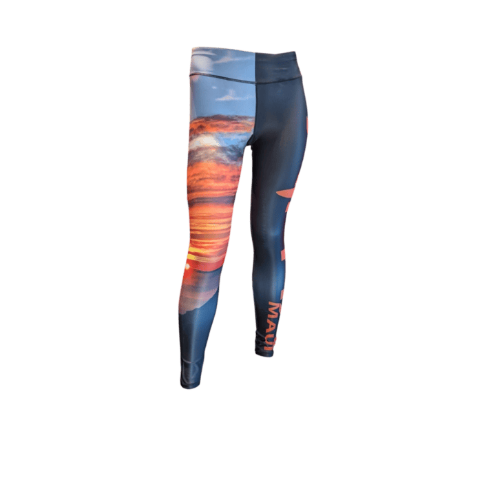 Leggings with a vibrant sunset design of red and orange over water on a blue sky, featuring "MAUI" vertically on the side. Product: Alpha Maui Haleakala (Full Length).