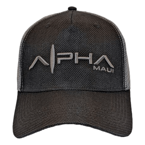 A black mesh baseball cap featuring the product name "Alpha Maui Alpha Clad" embroidered in stylized text on the front, with an "A" designed to resemble a mountain peak. The word "Maui" appears in smaller text to the right of "Alpha," making it a perfect addition to your beach apparel collection.