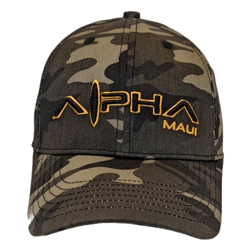 The Commander by Alpha Maui is a camouflage baseball cap with "Alpha Maui" embroidered on the front in orange. The hat features a mix of green, brown, and black colors typical of camouflage patterns, capturing the spirit of Hawaii's lush landscapes and Ohana unity.