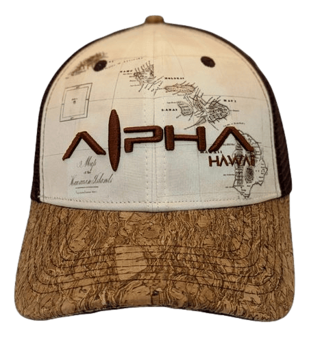 The Alpha Maui Wailea Islander is a beige and brown trucker hat featuring a vintage map design of the Hawaiian islands, perfect for beach apparel. The front displays "Alpha Maui" in bold, tan letters, with "Hawaii" below in smaller brown letters. The brim boasts a unique cork-like pattern, embodying the spirit of Ohana.