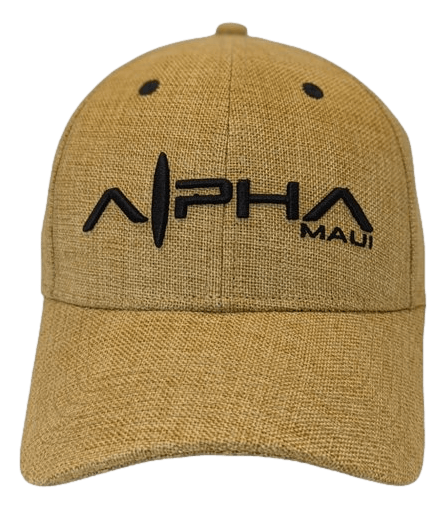 Introducing the Alpha Maui Regulator: a tan baseball cap crafted with textured fabric, ideal for beachwear. The front proudly displays bold black stitching of the word "Alpha," with a stylized letter "A" resembling a radio wave signal. To the right, "Maui" is stitched in smaller black letters, capturing the spirit of Aloha.
