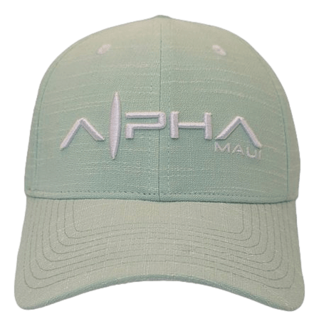 The Sprecklesville baseball cap is a light green hat featuring the text "Alpha Maui" embroidered in white on the front. It has a structured design with visible stitching patterns on the brim and crown, making it a perfect addition to your beach apparel collection.