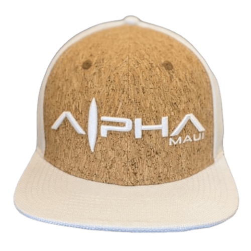 A baseball cap named "Ghost Cork" in light brown and beige, featuring the "Alpha Maui" logo embroidered in white on the front. Crafted from a textured material, this cap offers a natural, earthy appearance that embodies the spirit of Aloha.