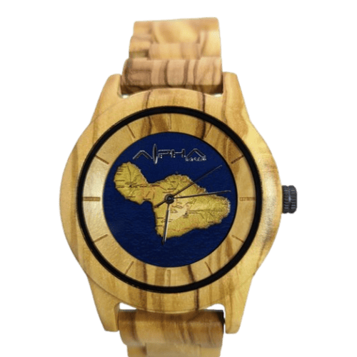 The Pueo Time wristwatch features a natural beige-colored wooden band and bezel. Its watch face presents a gold map of Africa set against a navy blue background, accented by simplistic black hour, minute, and second hands. The brand name "AFRICA" is prominently displayed on the upper part of the face, embodying an Aloha spirit in its design.