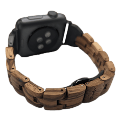 The Alpha Maui Band - Zebrawood 42mm (42-49mm) is a smartwatch featuring a black face and sensors on the back. It boasts a unique wooden band, designed with interlocking segments made from a mix of natural and polished wood, which provides a rustic yet modern aesthetic. This stylish combination makes it an ideal accessory to complement your beach apparel while radiating an Aloha spirit.
