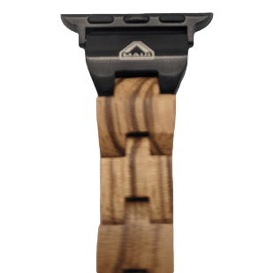 The Alpha Maui Band - Zebrawood 42mm (42-49mm) is showcased against a plain background, highlighting its unique, natural grain pattern and black fastening components. The clasp features a small triangular logo that subtly nods to the Aloha spirit.