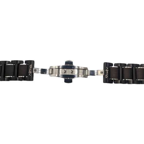 Here is a close-up view of the Alpha Maui Band - Zebrawood 42mm (42-49mm) with silver metal links and a deployment clasp. The unclasped mechanism reveals its intricate inner workings. "Ohana" markings near the clasp lend an emotional, beach-inspired touch to this black watch strap.