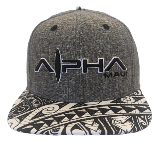 Introducing the Tribal 1: a gray baseball cap adorned with a tribal patterned brim that features intricate black and white geometric designs. The front prominently displays the word "Alpha" with a stylized "L," and has “Maui” written in smaller text to the side. Perfect for beachgoers who embody the Alpha Maui spirit of Aloha.