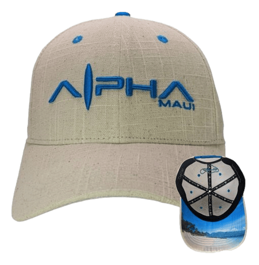 The Beachy II cap embodies the spirit of Aloha with "Alpha Maui" embroidered in blue on the front. It features a beige design with a matching blue button on top, while the underside of the brim showcases a scenic view of a tropical beach with ocean waves and palm trees.