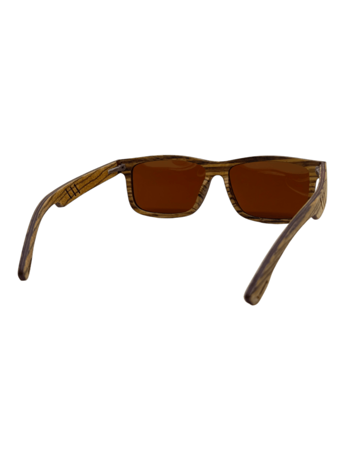 Front view of Cruisers 2.0 sunglasses with a wooden frame and brown-tinted lenses against a black background.