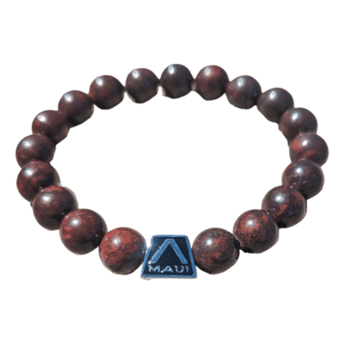 The Alpha Maui LangLinglet is a beaded bracelet with dark red-brown spherical beads, accented by a black square charm that showcases the word "Maui" alongside a white stylized letter "A." It's perfect for accentuating your beach attire and is an ideal accessory for those who embrace the spirit of Ohana and Alpha Maui vibes.
