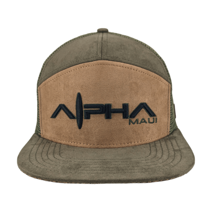 The Alpha Maui Kahmani trucker hat features a brown suede front panel with the words "Alpha Maui" in black. It has a green brim, and green mesh side and back panels, making it ideal beachwear for your next Hawaii adventure.