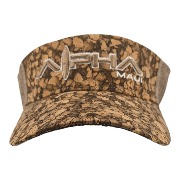 The Alpha Maui Mauka brown camouflage-patterned visor cap features the text "Alpha" and "Maui" embroidered in white on the front. It's perfect for beach apparel, with a unique design that incorporates a surfboard into the "A" of "Alpha," capturing the Aloha spirit of Hawaii.