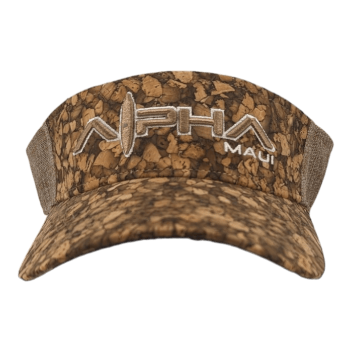 The Alpha Maui Mauka visor cap boasts a cork-like texture and pattern, with the embroidered "Alpha Maui" logo on the front in white text, incorporating a stylized surfboard into the word "Alpha." Ideal for beachwear, it also features an adjustable back for a perfect fit.