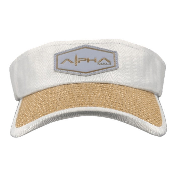 The Alpha Maui Mauka is a white visor hat with a woven beige brim and a hexagonal patch on the front displaying the text "Alpha Maui" alongside a stylized leaf design, making it perfect for beach apparel in Hawaii.