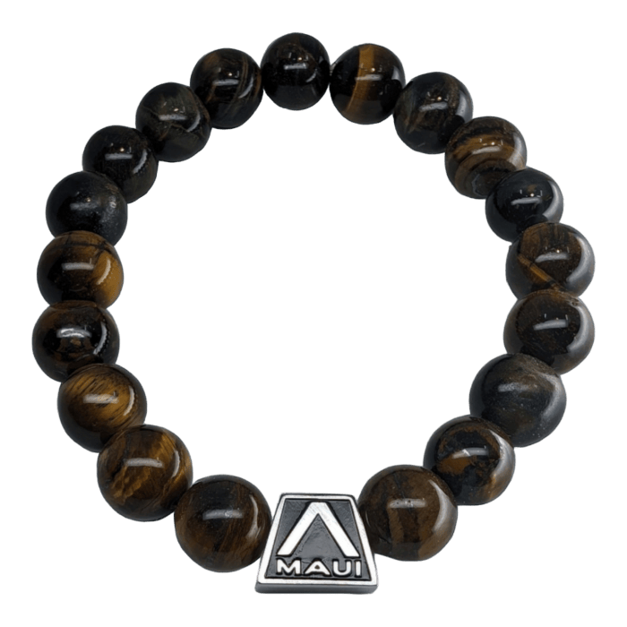 The Alpha Maui Tigerlet Glossy is a stunning bracelet made from polished, round tiger's eye beads that showcase streaks of dark brown, golden, and black hues. This beautiful piece features a metallic rectangular charm engraved with the word "Maui" and adorned with a stylized triangle design above the text, capturing the spirit of Ohana from Hawaii.