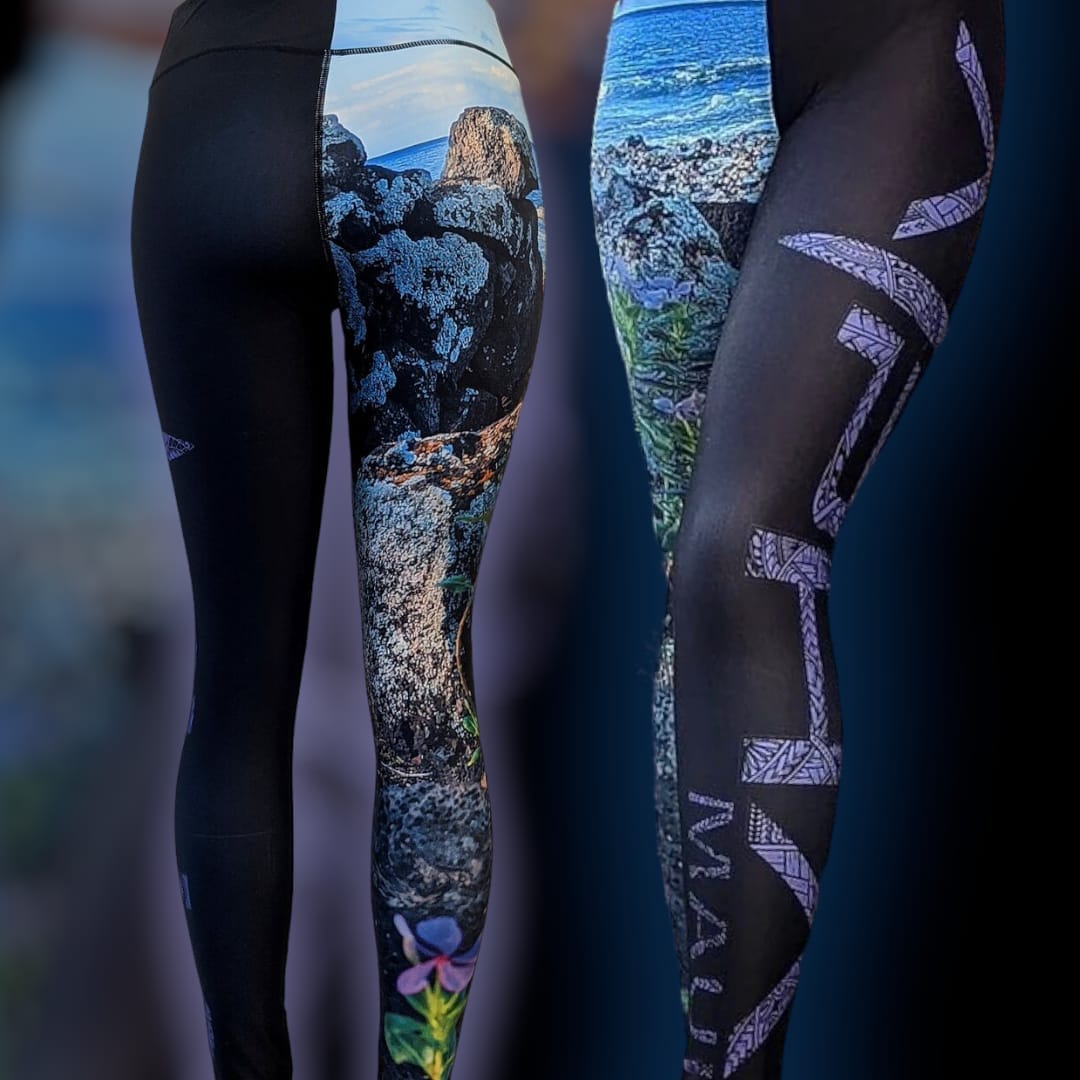 Two pairs of leggings are shown against a dark gradient background. Both have nature-themed designs: the left pair features black fabric with rock and flower imagery, while the right pair, in true Alpha Maui style, boasts a scenic coastal design with paths and geometric patterns reminiscent of Hawaii beach apparel.