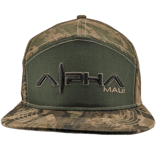 The Alpha Maui Upcountry Forrester is a baseball cap with a camouflage pattern and the words "Alpha Maui" embroidered in black and white on the front. The hat's body showcases a mix of dark green and brown camouflage designs, making it an ideal piece of beach apparel for your next Hawaii adventure.