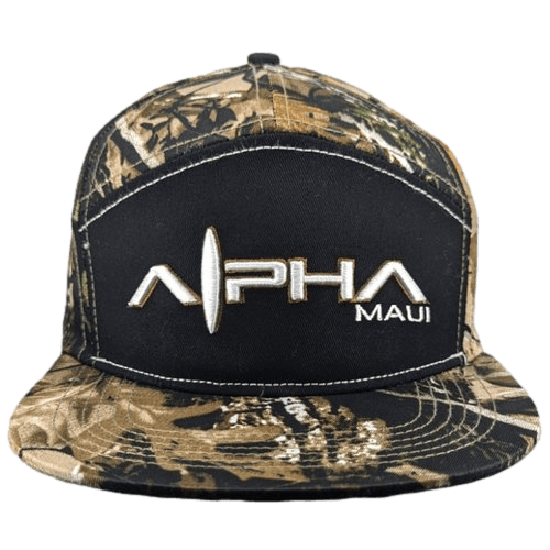 The Alpha Maui U'i Tank is an ideal piece for beach apparel, showcasing a stylish combination of a black front panel with the words "Alpha Maui" in white, partially stylized text. The brim and other panels feature a woodland camouflage pattern that perfectly captures the adventurous spirit of Hawaii.