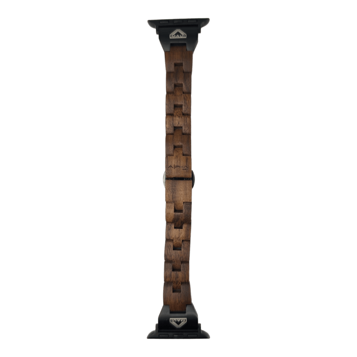 The Alpha Maui The Haleakalā smartwatch band from the Ohana collection is crafted from interlocking wooden pieces in a geometric pattern showcasing an array of dark and light brown tones. It features black metal connectors on both ends that attach seamlessly to the watch, all set against a black background.