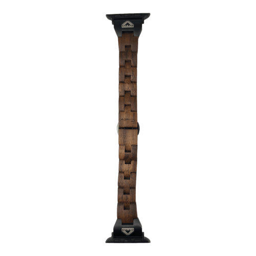 The Alpha Maui The Haleakalā features a wooden watch band with a dark wood grain texture and black metallic connectors at both ends. The band segments are linked together, creating a stylish, rustic appearance suitable for any smartwatch or wristwatch. Embracing the spirit of Ohana, the connectors have logos embossed on them.