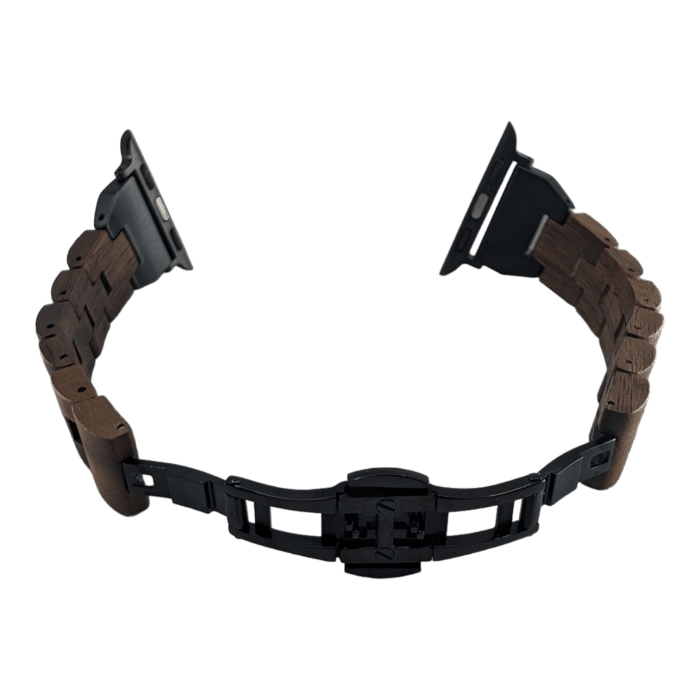 The Alpha Maui The Haleakalā wristwatch band features dark wood links paired with black metal connectors, shown in an open position. Its black metal clasp and end connectors are designed for easy attachment to a watch face. Inspired by the spirit of Alpha Maui, it evokes a touch of Hawaii against a solid black background.