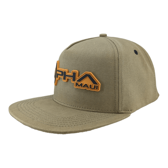 A beige snapback hat with an embroidered design featuring the text "Alpha Maui Coalition Forces" and "Ohana" in orange and black on the front. The hat has a flat brim and a small black button on top, perfect for any Hawaii adventure.