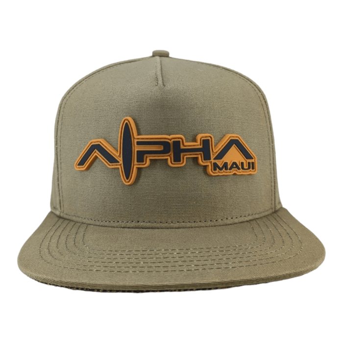 A khaki snapback hat with a flat brim, ideal for beach attire, features the text "Alpha Maui Coalition Forces" in bold, orange and black letters on the front. The word "Alpha" has a stylized, wavy line integrated into it. Aloha vibes included.