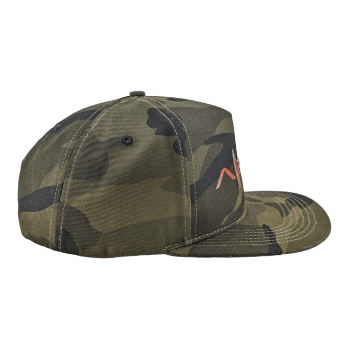 Side view of the Alpha Maui Coalition Forces baseball cap, showcasing a camouflage pattern in shades of green, brown, and black. Near the front, an embroidered design in orange is partially visible. This stylish cap features a curved brim and is set against a black background—perfect for beach apparel enthusiasts.