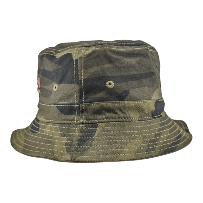 The Alpha Maui Coalition Forces camo bucket hat features a wide brim and a camouflage pattern in various shades of green and brown, perfect for blending into natural surroundings or complementing your beach apparel. It includes ventilation eyelets on the sides and visible stitching along the brim.