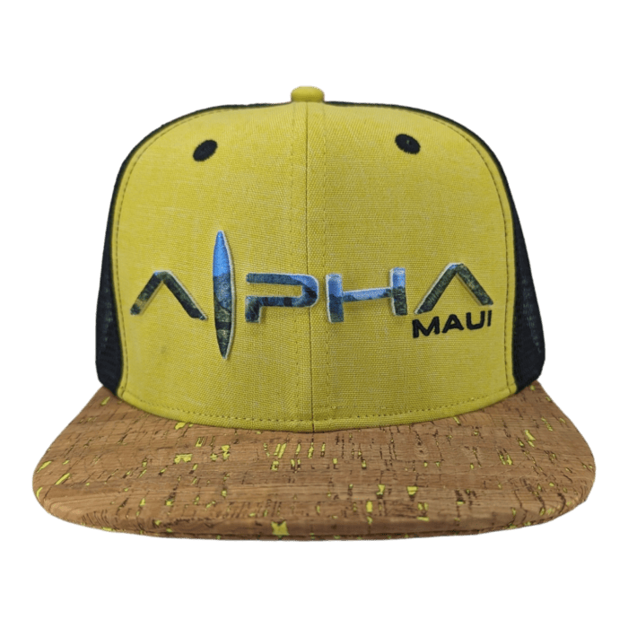 A yellow and brown "Alpha Maui The Valley Isle" baseball cap with a cork-textured brim. The front features the text "Alpha Maui" in bold lettering, with a stylized design element between "Alpha" and "Maui." Perfect for beach apparel, the sides and back of the cap are black mesh.