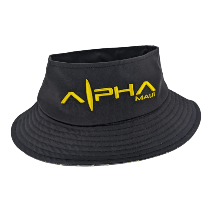 A black "Alpha Maui Bee Bucks" bucket hat featuring "Alpha Maui" embroidered in bold yellow letters on the front and a stylized yellow vertical line between the words. The hat, perfect for an Aloha vibe, includes decorative stitching on the brim.