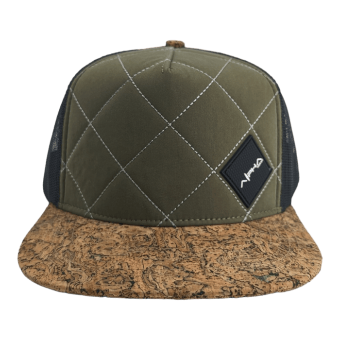 A green quilted hat featuring a diamond pattern on its front panel and the word "Aloha" subtly embroidered. It has a black mesh back and a brown cork-like brim. A small black patch with white text is sewn onto the front, adding to its unique charm.