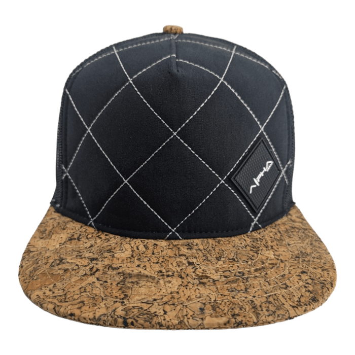 A baseball cap featuring a black crown with white diamond-shaped stitching and a small patch logo on the front. The hat, part of our exclusive Alpha Maui beach apparel, has a unique textured brown cork brim and a small button on top.