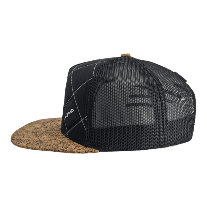 A stylish black and brown cap with a mesh back and a cork-patterned brim. The front features a grid pattern with a small white logo on the left side. Perfect for beach apparel, this Alpha Maui design incorporates breathable mesh material ideal for Hawaii's warm climate.