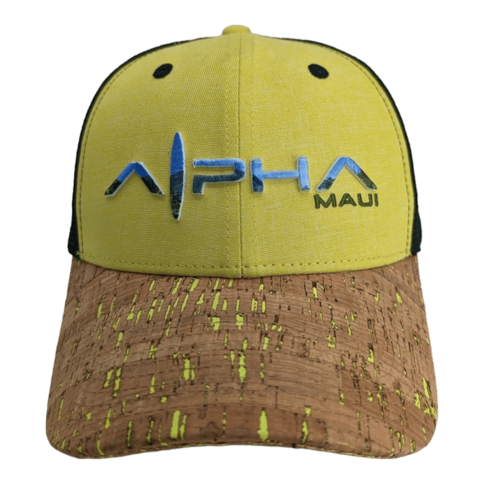 A yellow and black baseball cap with a cork-textured brim perfect for your beach apparel collection. The front showcases the text "Alpha Maui" in striking blue and green letters, capturing the Ohana spirit perfectly.