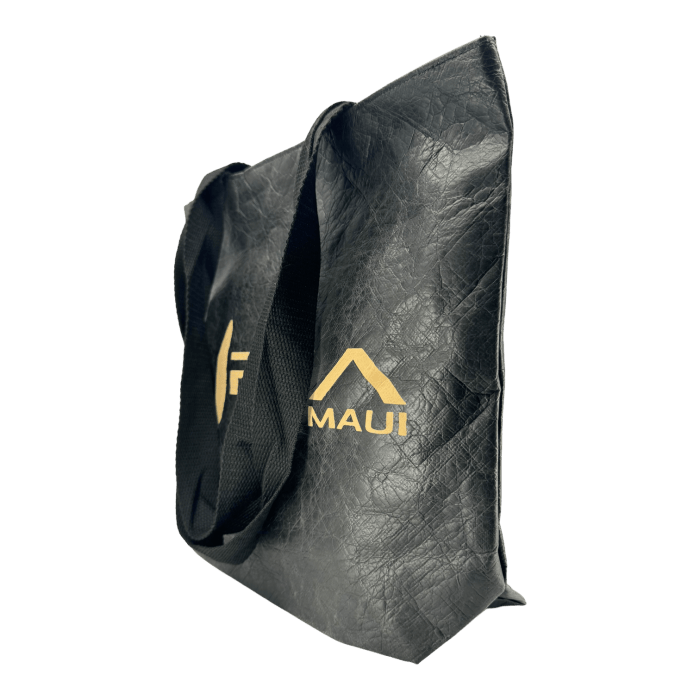 Presenting the Alpha Maui Dupont Bag: a sophisticated black tote adorned with matching black straps. This bag features a textured surface, complemented by a gold logo and the text "Alpha Maui" beneath it. The plain black background accentuates the tote, evoking subtle hints of Aloha from Hawaii.