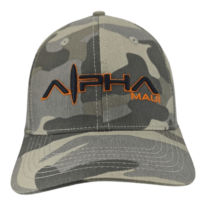 A camouflage-patterned baseball cap featuring an orange embroidered logo that reads "Alpha Maui" on the front. Embodying the Aloha spirit of Hawaii, the cap has a structured front panel and a curved brim.