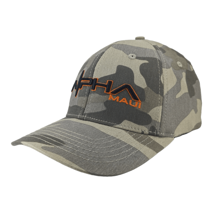 A camouflage baseball cap with a green, gray, and beige pattern. The front of the cap has black and orange embroidered text that reads "Alpha Maui." This piece of beach apparel features a curved brim and is set against a plain white background.