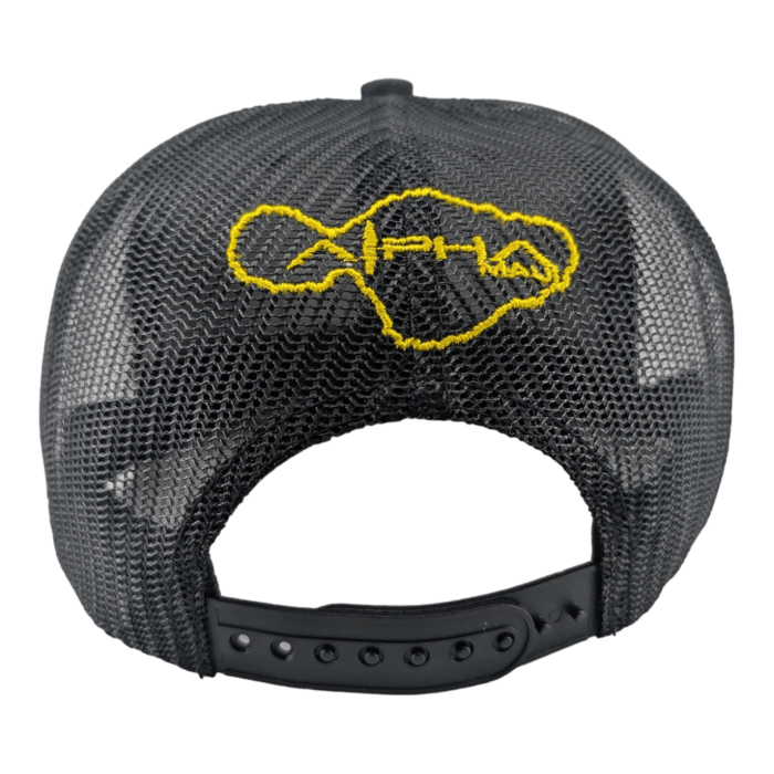 The image shows the back of a black mesh trucker hat with an adjustable snapback closure. Embroidered on the mesh in yellow stitching is an outline of the Hawaiian Islands and the word "Aloha" integrated within the design, making this a perfect piece of beach apparel for your Alpha Maui adventures.